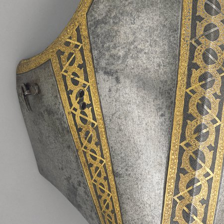 A detail of a sixteenth-century breast plate with gold detailing
