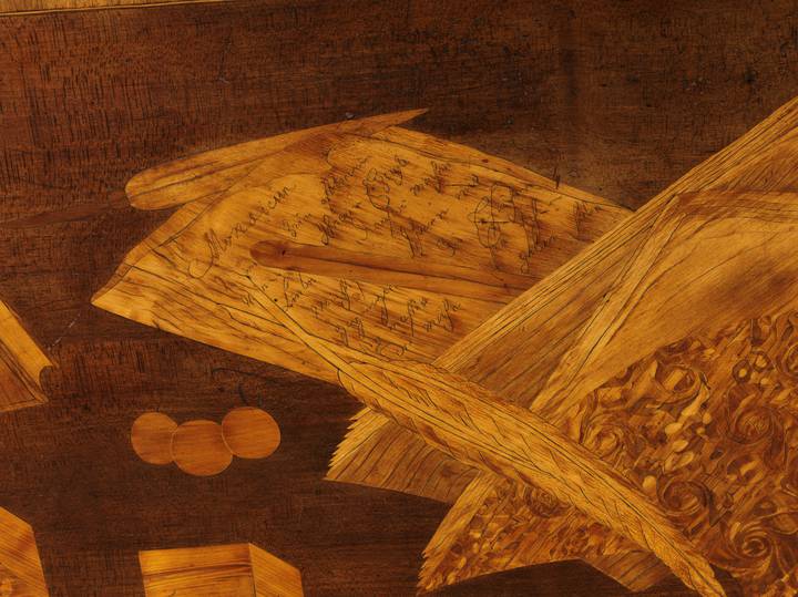 Detail of pictorial marquetry, engraved in German. Roll-top desk (F102).