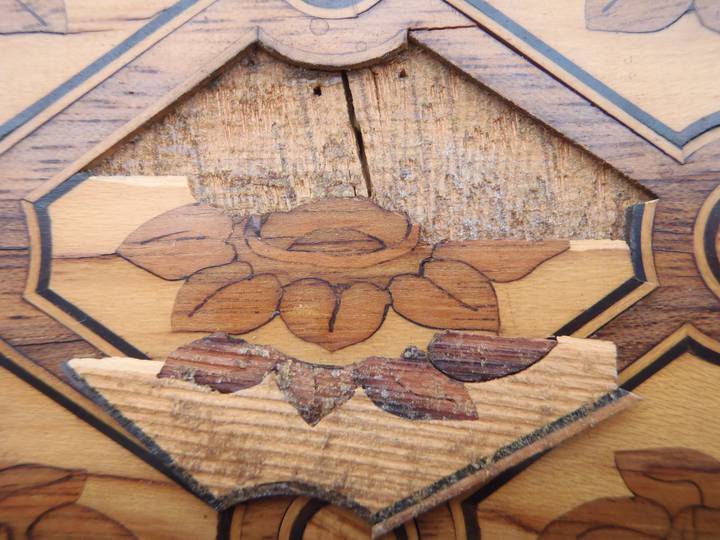Detail of the underside of a piece of trellis marquetry, showing some of its original colours. Attributed to Jean-Henri Riesener, Chest-of-drawers, 1780 (F247).