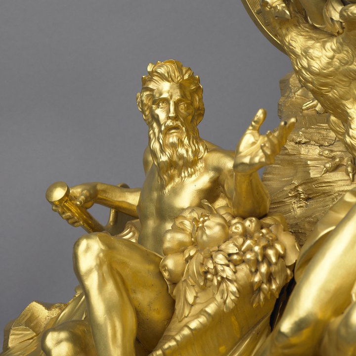 A detail of a gilt-bronze mantel clock