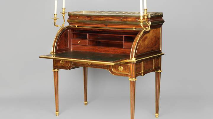 A mahogany-veneered cylinder desk, open