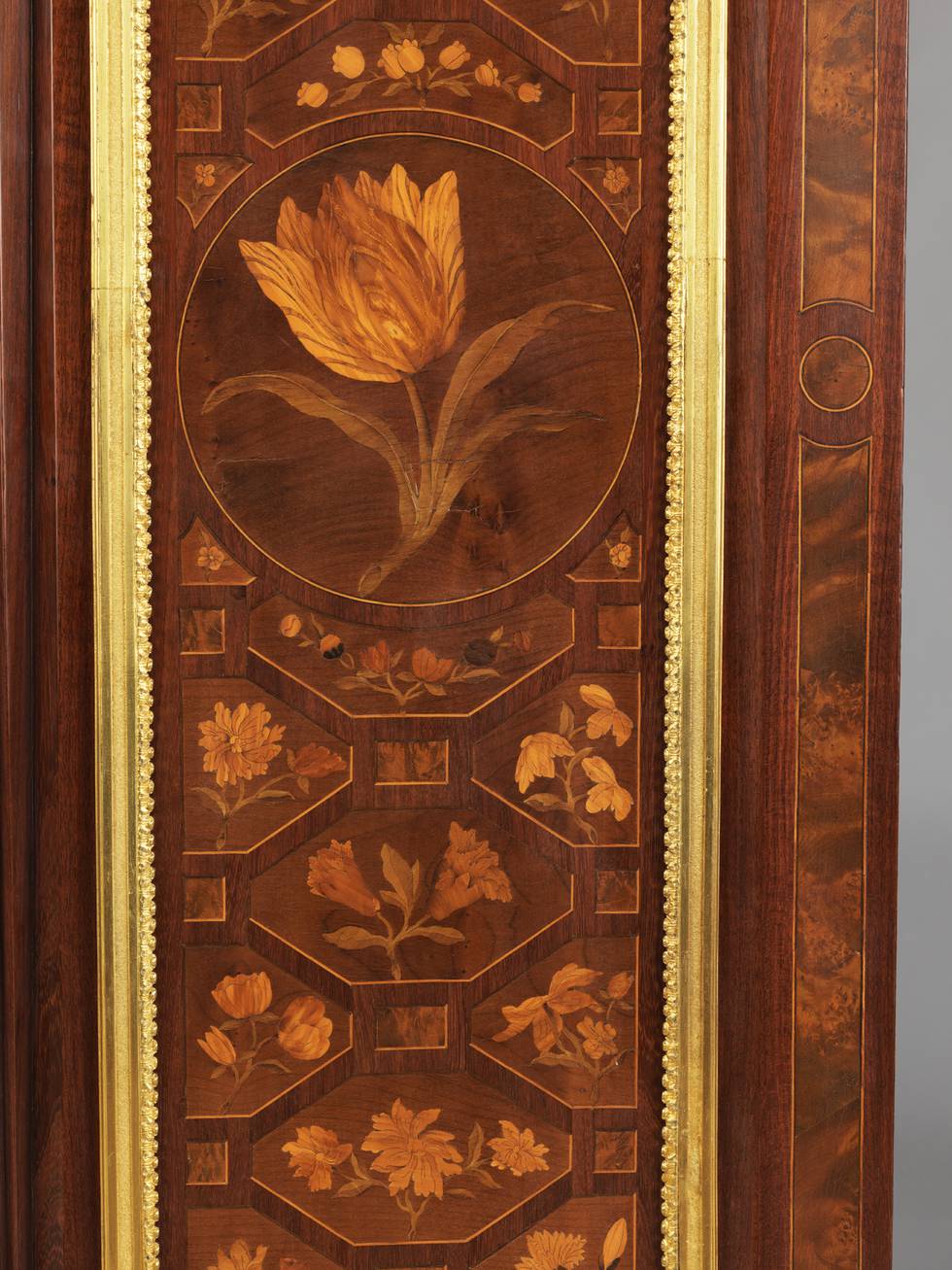 A detail of trellis marquetry on a fall-front desk