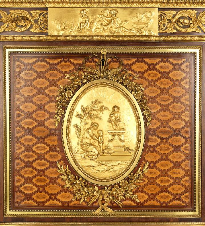 Detail of fall-front, showing trellis marquetry and two gilt-bronze plaques. Fall-front desk (F302).