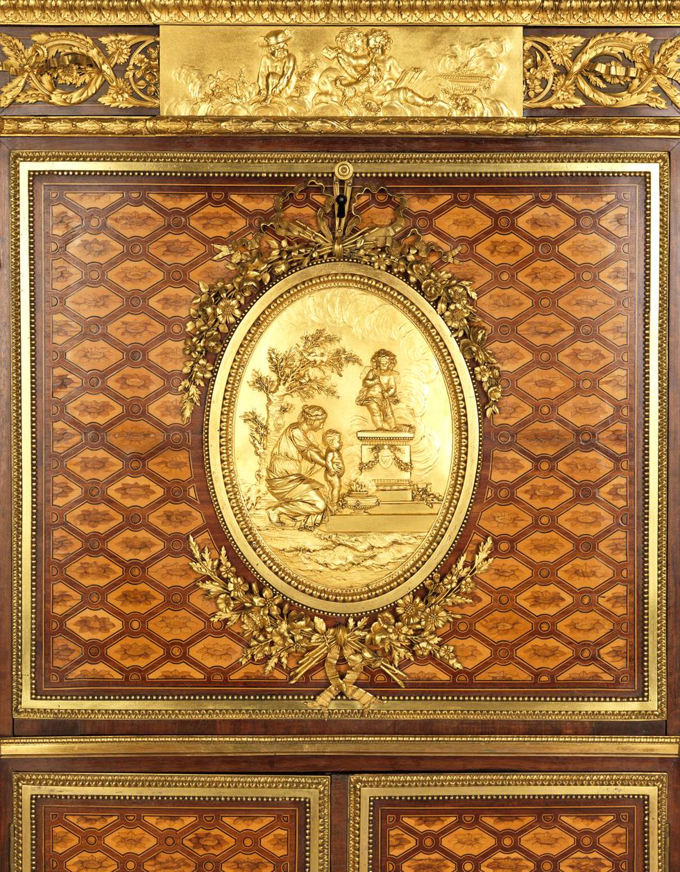 A detail of the frieze and fall-front of a marquetry fall-front desk