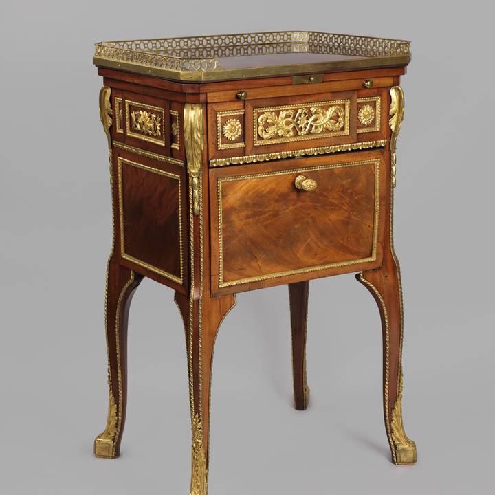 A mahogany-veneered writing and toilet table