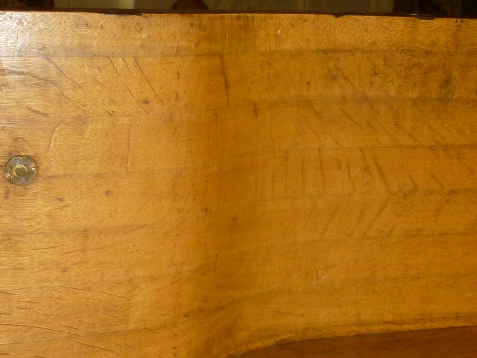 A detail of small pieces of oak laminated horizontally on a marquetry chest of drawers