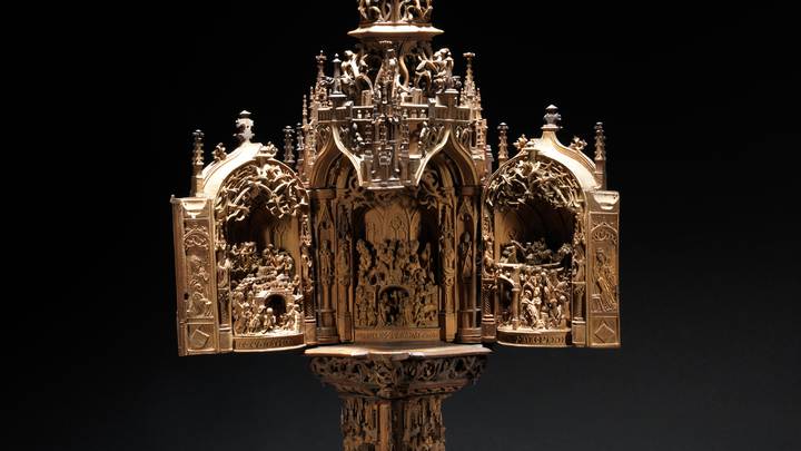 A wooden triptych carved with the Adoration of the Magi